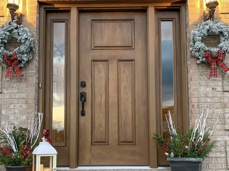 Stained wood-look entry door with two glass sidelights